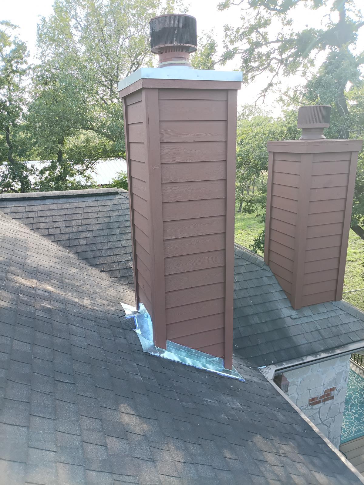 Freshly rebuilt and painted chimney chase with new rain cap