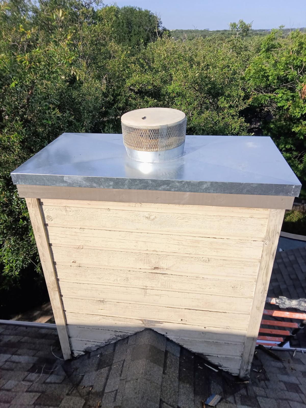 New galvanized chase cover and round rain cap on a wood chase