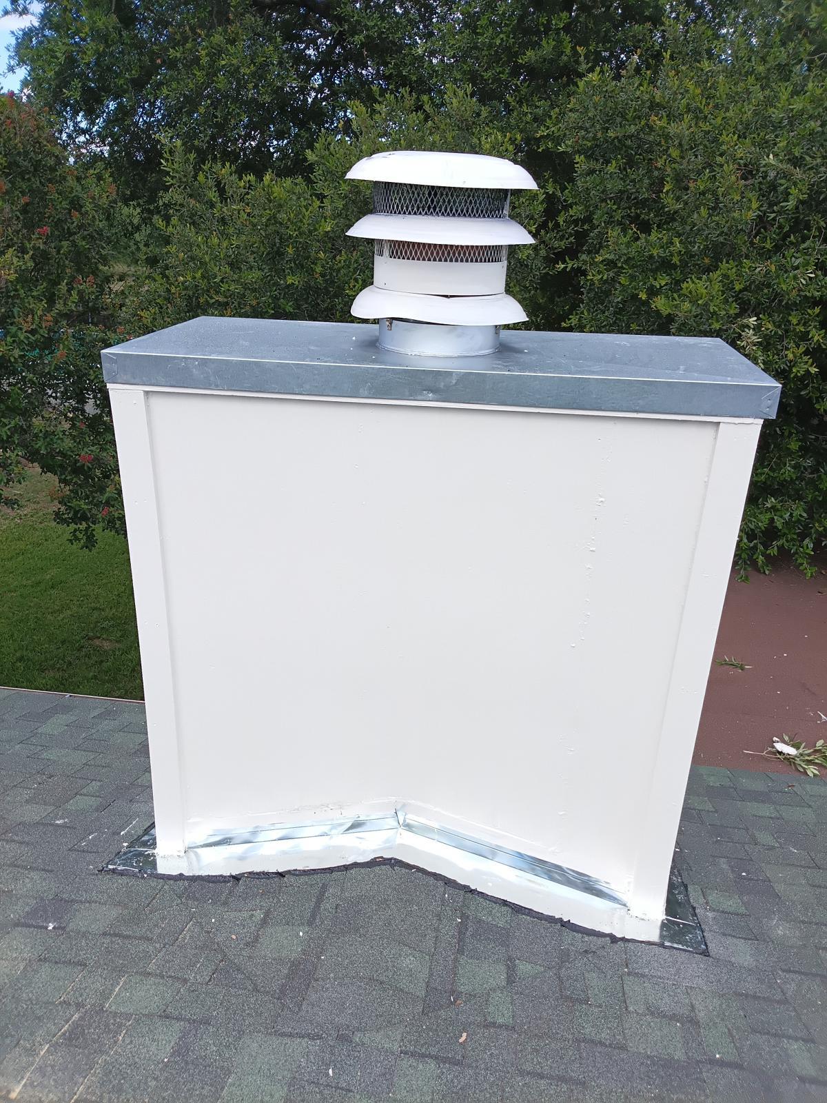 Chimney chase prepared for paint with new base flashing
