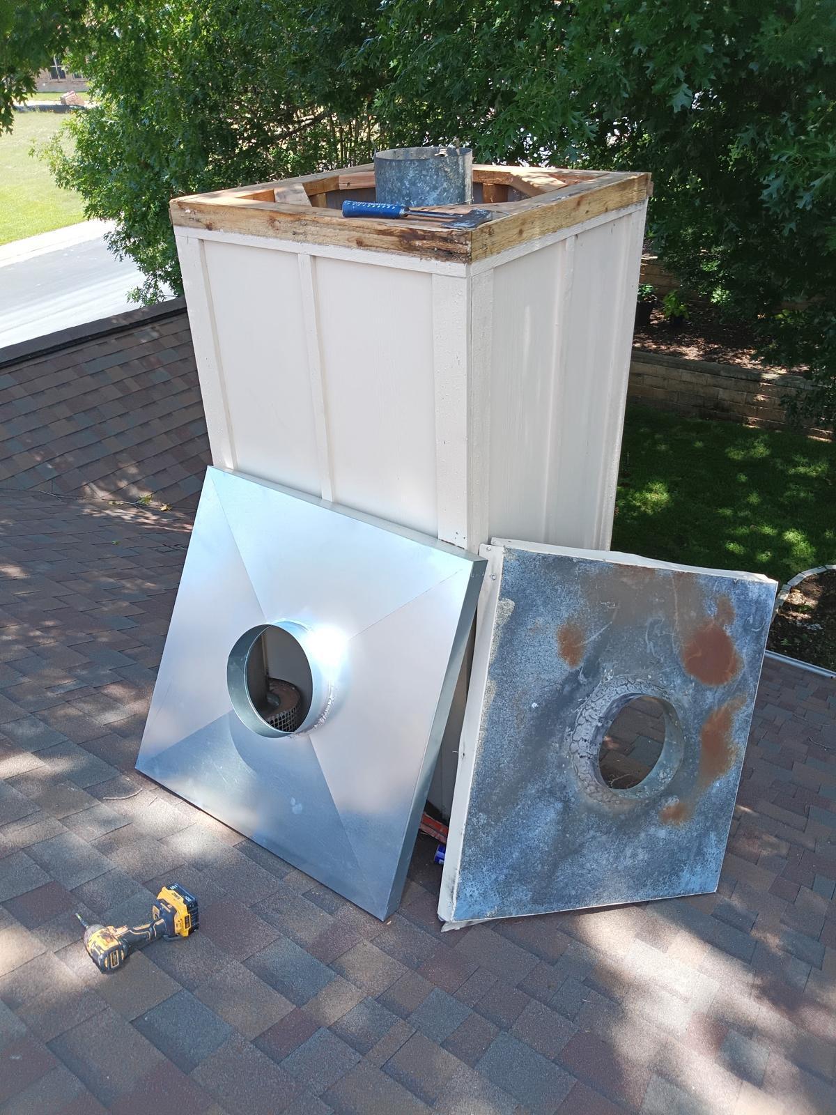Old rusted chase cover next to new galvanized replacement cover
