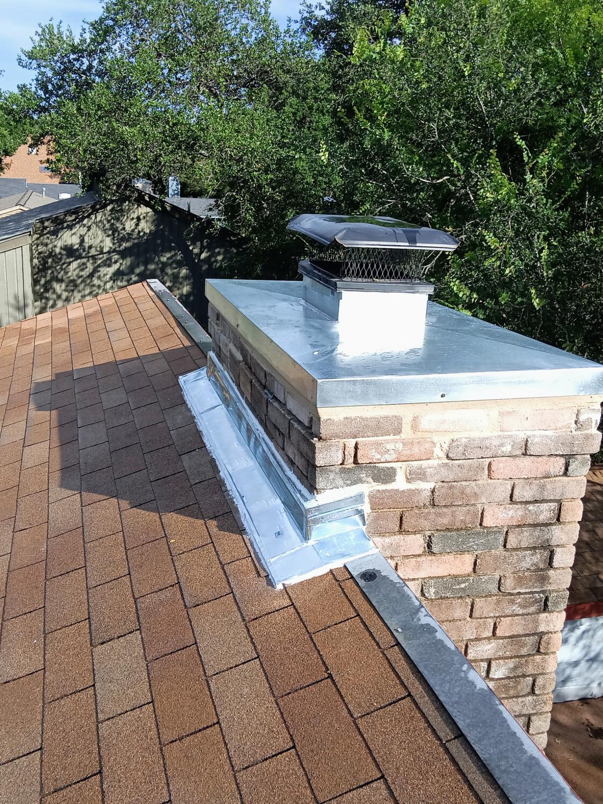 Completed chimney chase restoration with new cap and cover