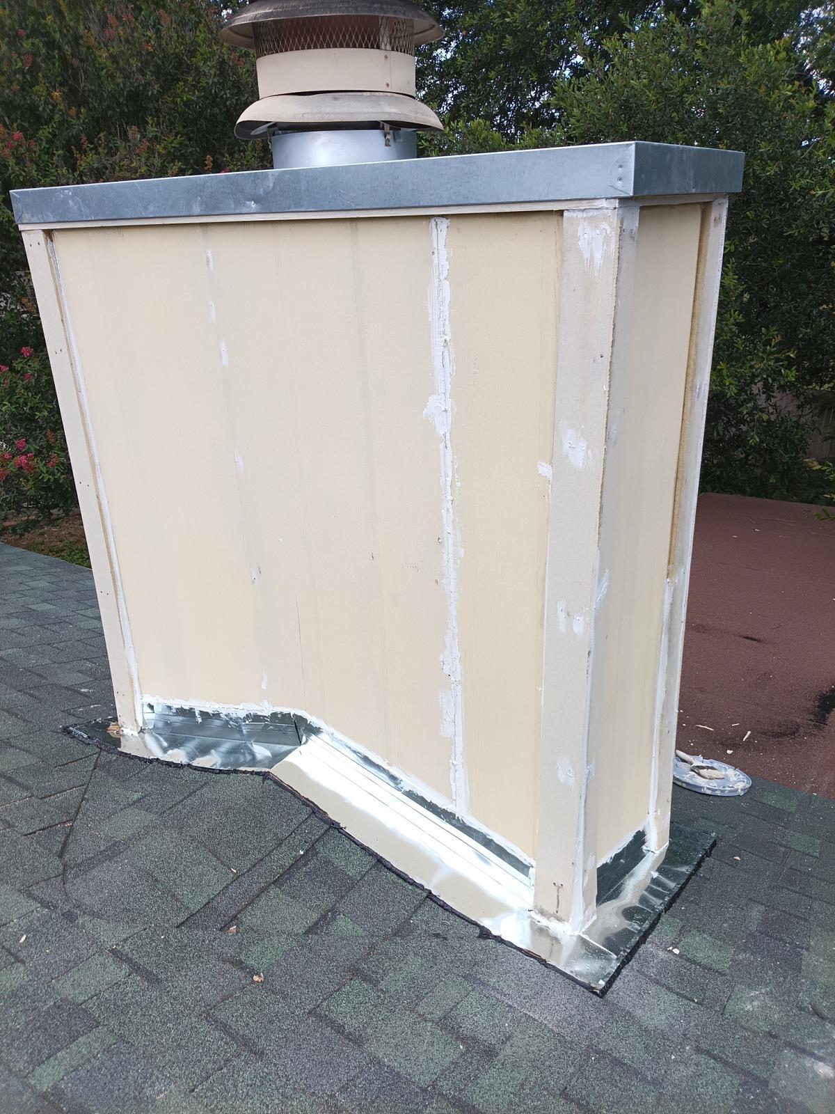 New galvanized chase cover installed on a chimney chase